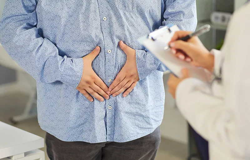 A patient consulting a specialist for his bowel or rectal symptoms.