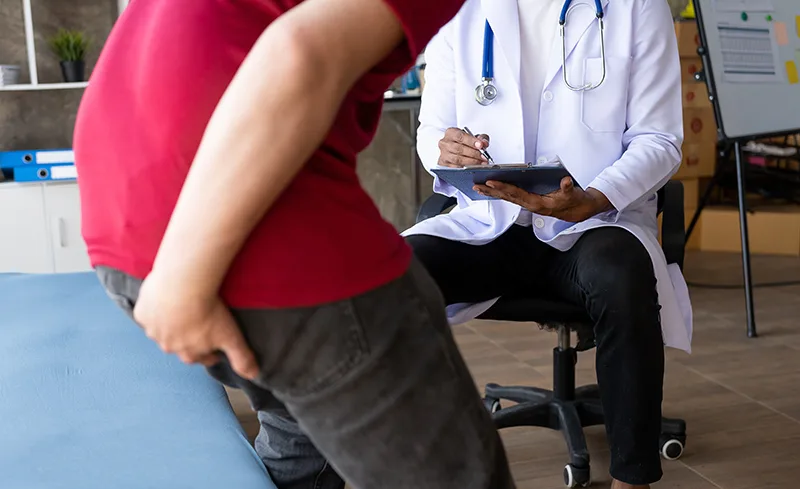 A patient consulting a specialist for haemorrhoid surgery