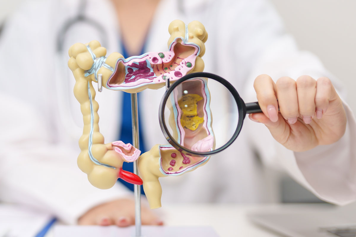 Consultant colorectal surgeon explaining colorectal cancer treatment to a patient