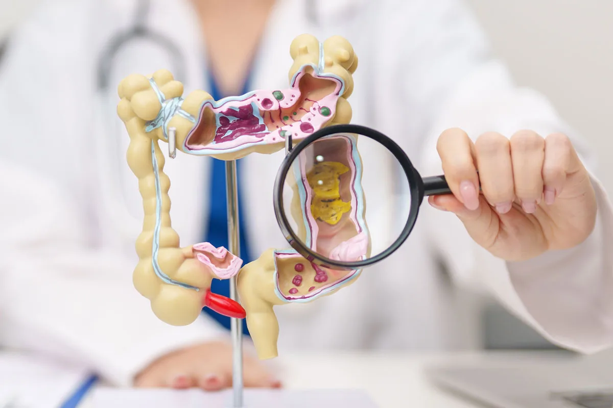 Consultant colorectal surgeon explaining colorectal cancer treatment to a patient
