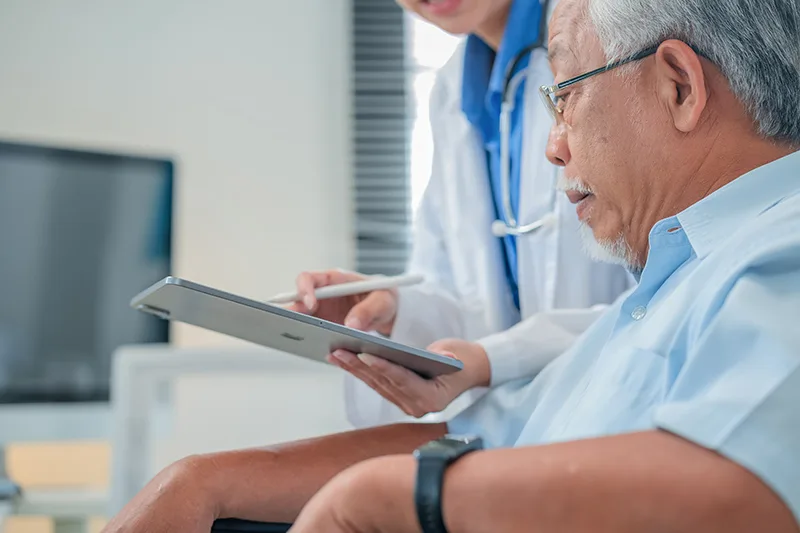 An elderly man proactively preparing for his colonoscopy